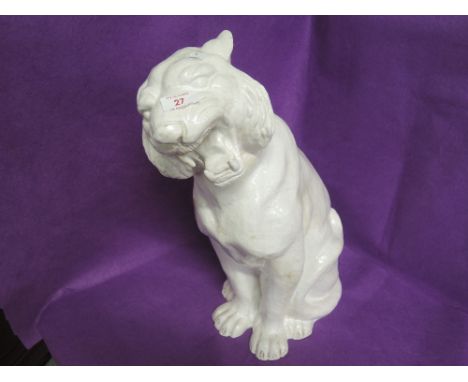 A large ceramic tiger figure with white crackle glaze