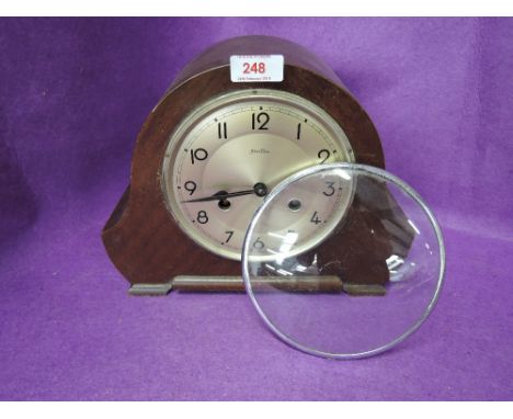 A treen body mantle clock with Napoleon style shape and chime by Bentima