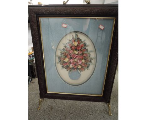 A vintage fire screen with floral relief insertGood general condition