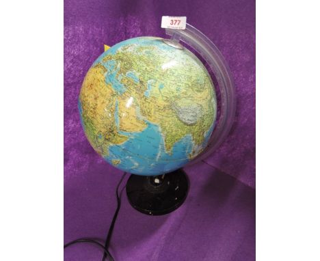 A vintage light up globe of the world