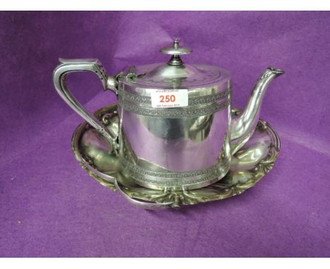 A vintage plated tea pot and similar serving tray 