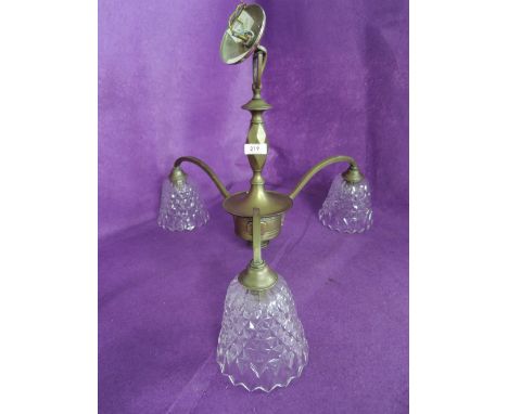 A vintage brass and glass light fitting 