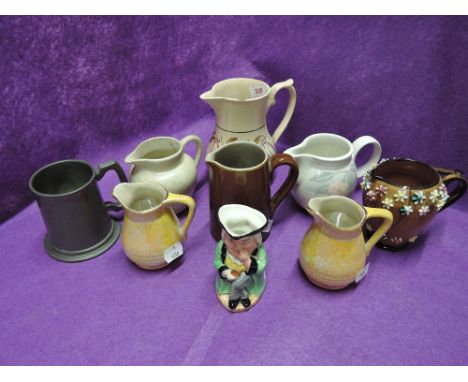 A selection of vintage ceramic jugs including lustre glazed