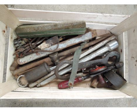 A box of various tools extension bars, hand drill, spanners etc