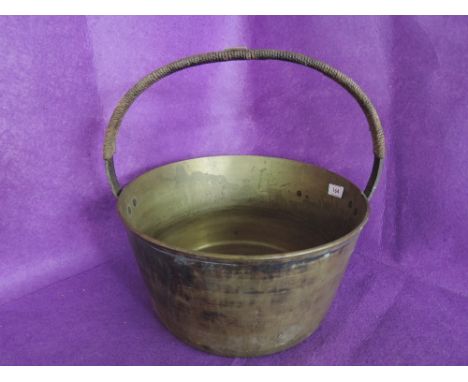 A vintage brass cast jam pan 