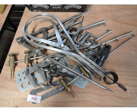 A selection of gauges, calipers, and other measuring tools