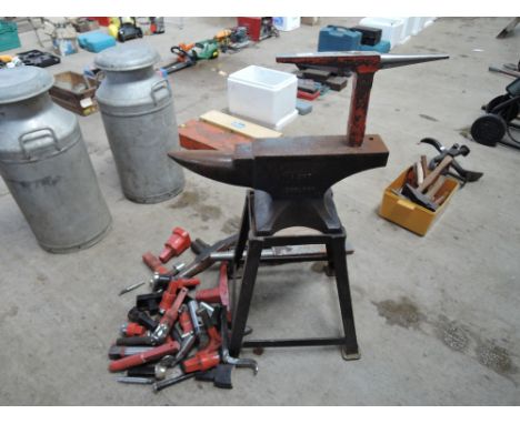 A 51kg Anvil on stand with fittings and tools