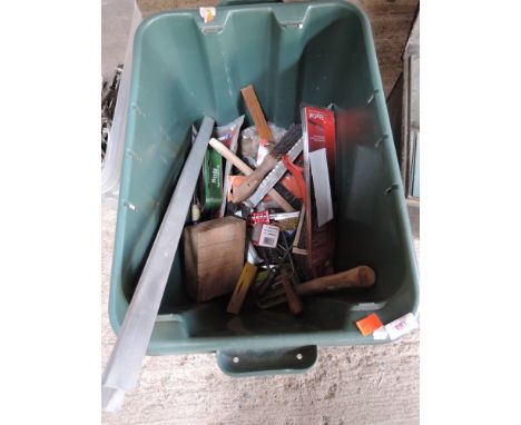 A box of tools including spirit level, rasps and files