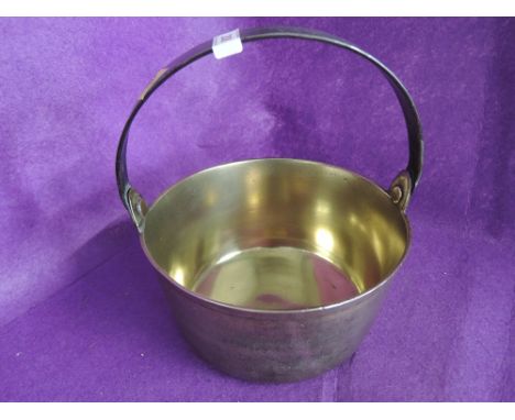 A vintage brass cast jam pan 