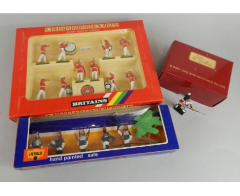 A Britains US Marine Corps bandsmen set, no 7305, a Herald handpainted model horseguard soldiers no.4906 and a Victoria Cross