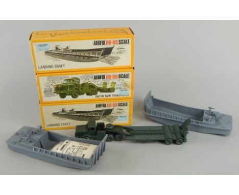 An Airfx HO-00 scale Antar tank transporter and two landing craft vehicles, 2cm high (3, boxed)