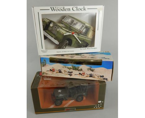 A wooden Landrover Defender clock , a Desert Storm crawling soldier and a Model of a  jeep. (3 - boxed)