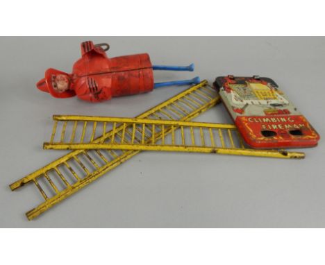 A unusual Marx tin plate and plastic clockwork model of a climbing fireman. (AF)