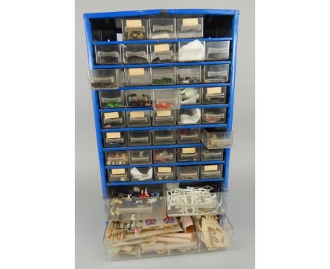 An industrial blue painted metal workshop cabinet, containing a large quantity of model soldier limbs, accessories, etc.