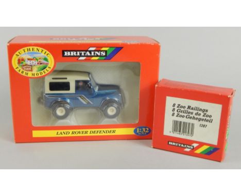 A Britains 1:32 scale model Landrover Defender, 7cm high and 8 zoo railings (2, boxed)