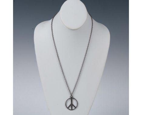 Dark silver metal peace sign pendant measuring 1.25"L x 1.25"W. The chain has a spring ring clasp and measures 23.5"L. Condit