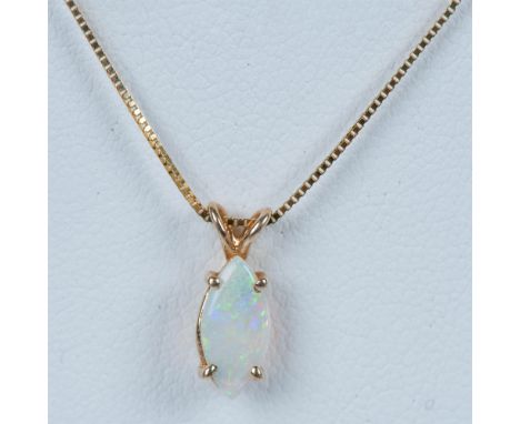 Petite marquise shaped opal on a cute chain that is stamped 14kt near the spring ring clasp and measures 18"L. Condition: Age