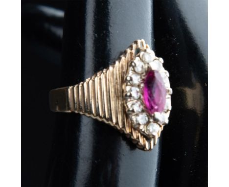 This ring is marked T&amp;L 14KP inside the band. It has a marquis cut ruby center stone surrounded by round clear diamonds. 