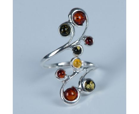 Gorgeous ring with round amber stones set in sterling silver. Stamped 925 inside the band. Size 8, but it can be adjusted. 4g