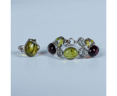 Light green and cherry amber bracelet with a bar and loop clasp measures 8"L end to end. The light green amber ring has an ad