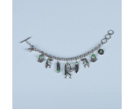Pretty Native American sterling silver bracelet with charms featuring Kokopelli and other tribal symbols decorated with green