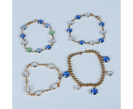 The bracelets have clear, blue, and green crystals and they measure approximately 7.5"L end to end. Monet stamps on the metal