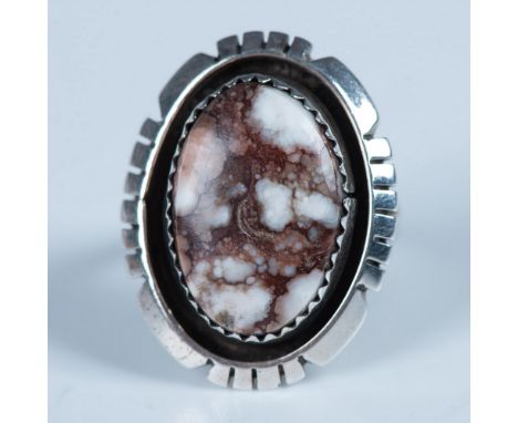 Handmade ring with a wild horse "turquoise" magnesite stone set in sterling silver. An illegible Native American artist mark 