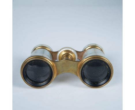 These vintage binocular opera glasses have Mother of Pearl tiling with brass accents and telescoping lenses. They are marked 