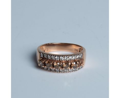 This beautiful yellow gold ring has two rows of round clear diamonds with a row of chocolate brown diamonds in the middle. It