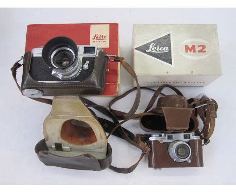 Leica M2-995 442 rangefinder camera, a Summaron lens serial number 1810648, an&nbsp;IROOA lens hood, in brown leather case, a