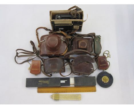Voigtlander Vito B camera in brown leather case, an Exakta VX1000 camera in brown leather case, a Zeiss Ikon camera in brown 