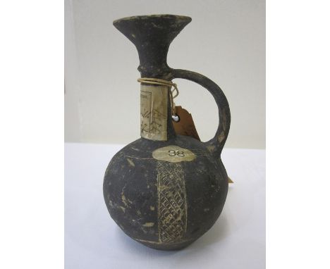 Early Bronze Age Cypriot terracotta ewer with incised geometric decoration with everted rim, curved handle to the bulbous bod