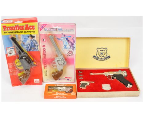 Lone Star &amp; Crescent - A Group of Packaged Toy Pistols. Comprising: 'Luger Presentation Set'; 'Frontier Ace'; 'Texas Rapi