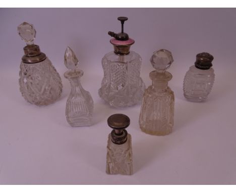 SILVER, WHITE METAL MOUNTED &amp; GLASS TOPPED SCENT BOTTLES (6) to include a cut glass bell shaped atomizer with Sterling an