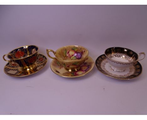 CABINET CUPS &amp; SAUCERS (3) including Aynsley printed fruit bearing facsimile M Brunt signature, Caverswall Romany and Que