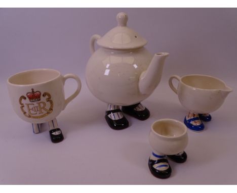 CARLTONWARE WALKING CHINA TABLEWARE to include a lidded teapot, jug, egg cup and a commemorative mug (all over crazing and so