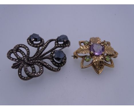 9CT GOLD &amp; STERLING SILVER BROOCHES (2), the gold example flower and leaf form with central Amethyst and outer Peridots, 