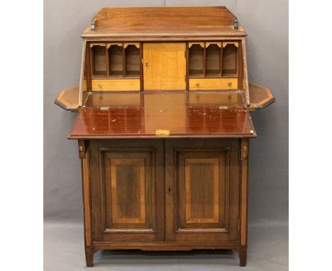 EDWARDIAN CROSSBANDED MAHOGANY FALL-FRONT BUREAU CUPBOARD having an upper railback shelf and twin shaped side shelves, the fa