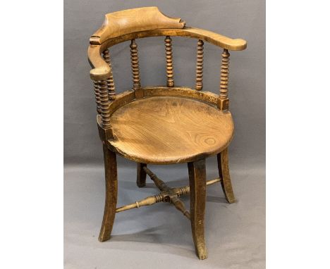 VICTORIAN CIRCULAR OFFICE ARMCHAIR the curved back with bobbin turned supports and lower turned cross stretcher, 81cms H, 62c