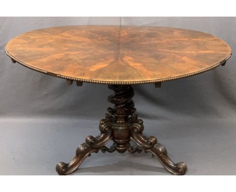 HIGH VICTORIAN ROSEWOOD BREAKFAST TABLE, the 128cms diameter top with highly figured segmented veneers and a beaded rim over 