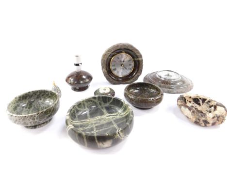 A group of serpentine, including a circular wall barometer, circular thermometer, squat table lamp, bowls, paperweight and a 