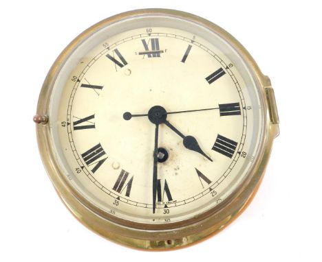 A 20thC brass circular cased ship's clock, enamel dial bearing Roman numerals, back plate etched for 'The Chart Room', ESSO T