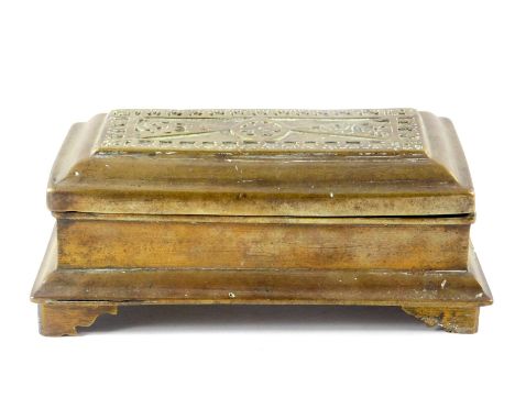 An 19thC Malayan brass beetle nut casket, of rectangular three division form, the hinged lid embossed with scrolling leaves a