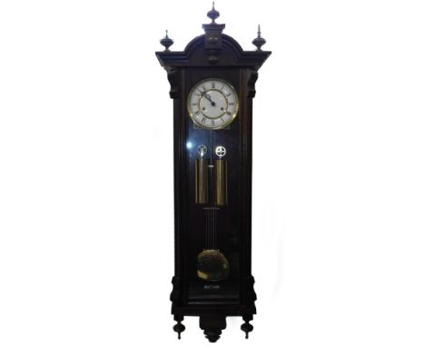 A 20thC Continental mahogany cased wall clock, brass dial with enamel chapter ring bearing Roman numerals, eight day two trai