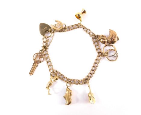 A 9ct gold double link charm bracelet, on a heart shaped padlock clasp with safety chain and nine charms as fitted, 15.8g.