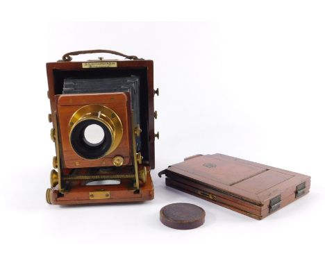 A 1900 BB Instantograph Patent mahogany and brass camera, by J Lancaster &amp; Son, Birmingham, together with one mahogany pl