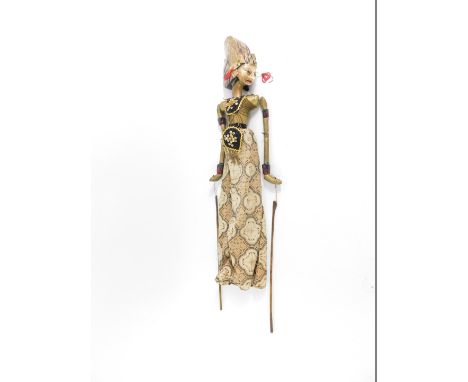 A vintage Javanese Wayang doll wooden stick puppet, modelled with traditional head dress and clothing, 75cm H.