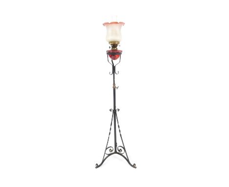 A Victorian duplex standard oil lamp, with a ruby glass reservoir, glass chimney and Art Nouveau floral frosted clear to cran