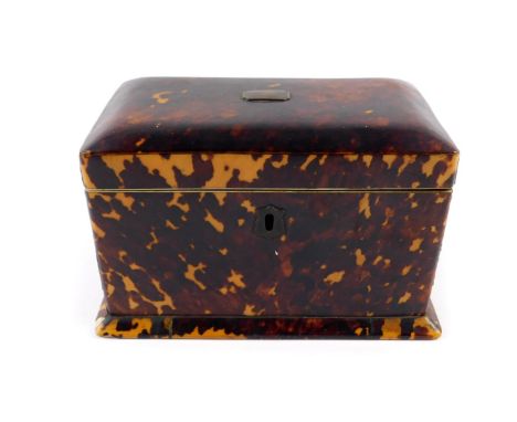 A Georgian blonde tortoiseshell tea caddy, of rectangular form with ivory stringing and brass plate to the hinge lid, opening