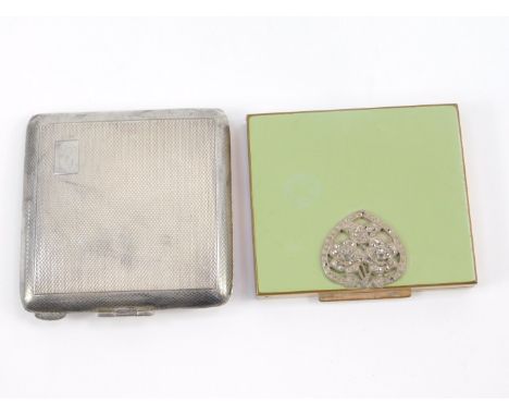 A George V silver compact, with clip hinge, engine turned decoration, rectangular reserve, initial engraved, Birmingham 1935,
